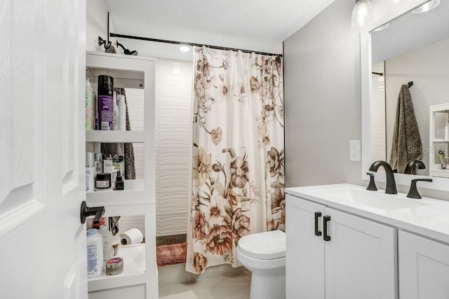 bathroom with vanity, toilet, tile patterned flooring, and a shower with shower curtain