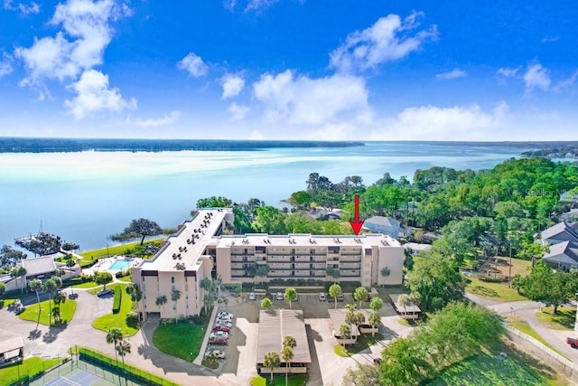 birds eye view of property with a water view