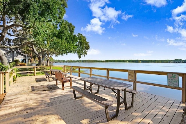 dock area with a deck with water view