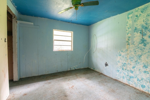 spare room with ceiling fan and carpet floors