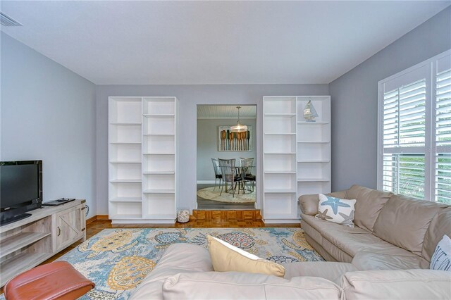 living room featuring a healthy amount of sunlight and wood-type flooring