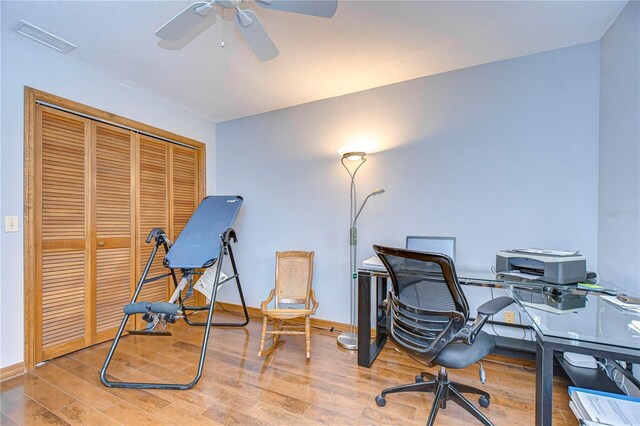 office space featuring ceiling fan and light hardwood / wood-style flooring