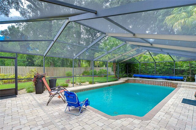 view of pool with a lanai and a patio