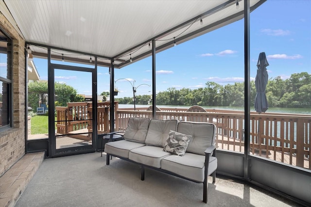 sunroom with a water view