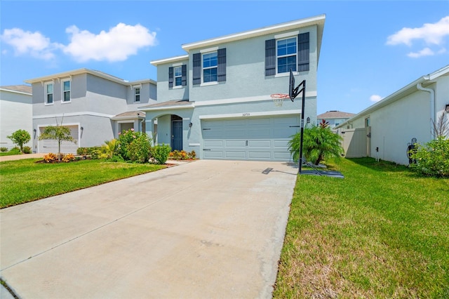 view of front of property with a front yard and a garage