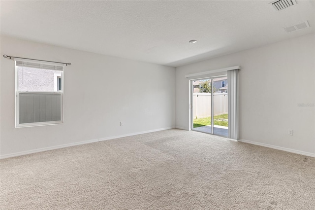 spare room featuring carpet flooring