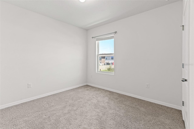 spare room featuring carpet floors