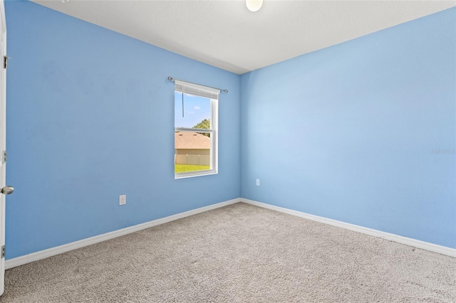 unfurnished room with carpet flooring