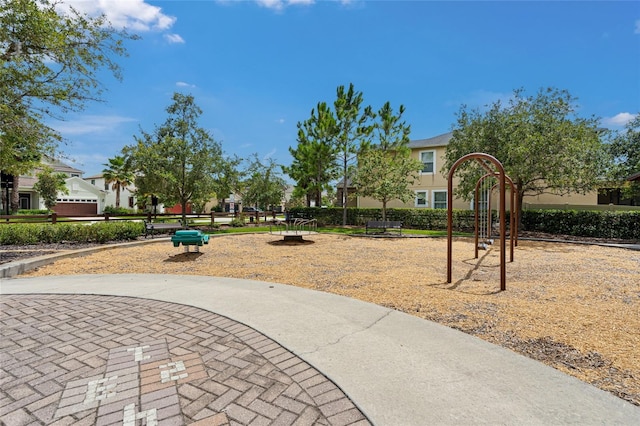 view of home's community featuring a playground