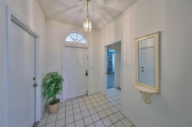 foyer featuring light tile patterned floors