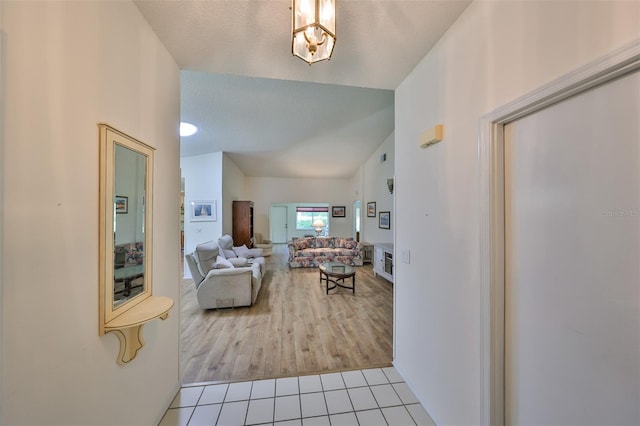 interior space featuring a textured ceiling and light hardwood / wood-style floors