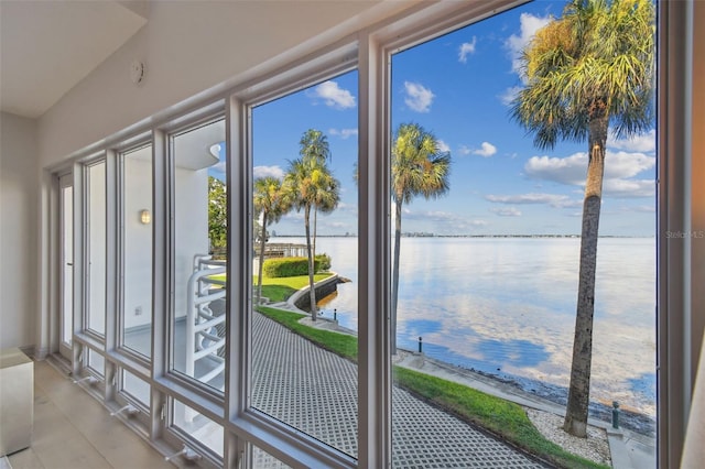 doorway to outside featuring a water view