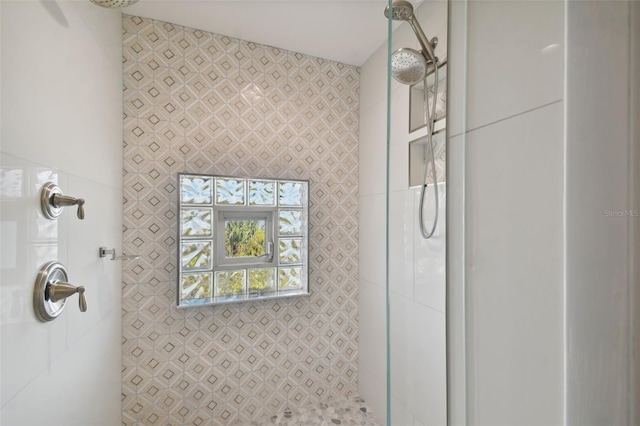 bathroom with tiled shower