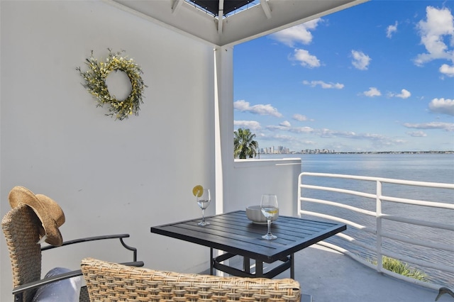 balcony featuring a water view