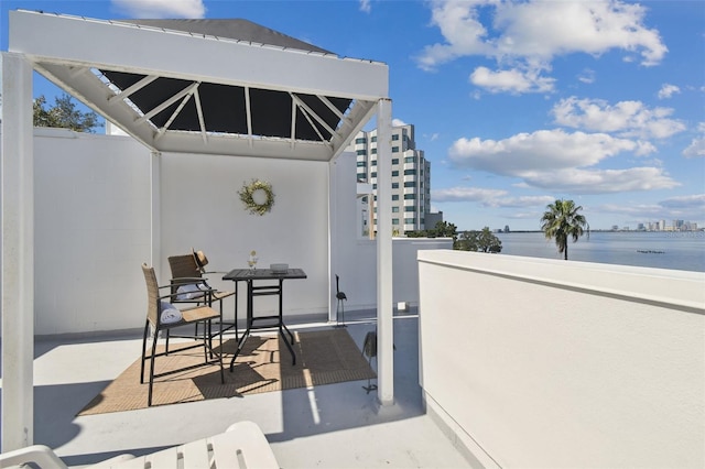 view of patio / terrace featuring a water view