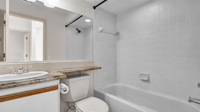 full bathroom featuring vanity, toilet, and tiled shower / bath