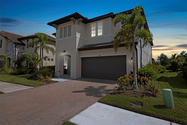 mediterranean / spanish house featuring a garage