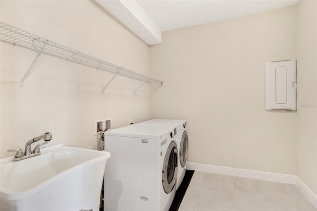 laundry room featuring washer and dryer, light tile patterned floors, electric panel, and sink