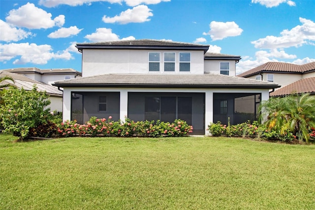 back of house featuring a sunroom and a yard