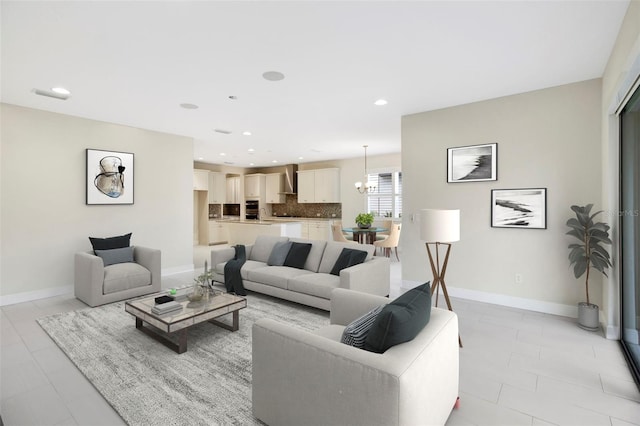 tiled living room with a notable chandelier