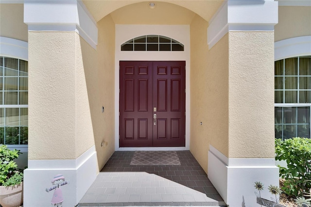 entrance to property featuring a porch