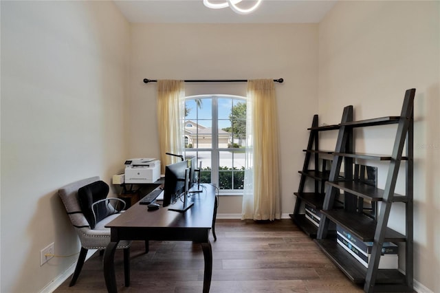 office with dark hardwood / wood-style flooring