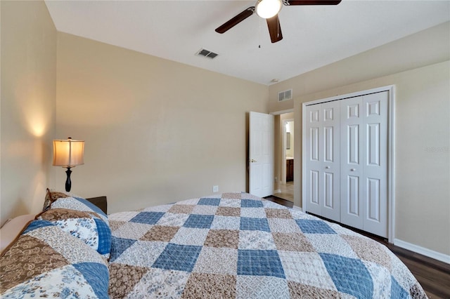 bedroom with hardwood / wood-style floors, ceiling fan, and a closet