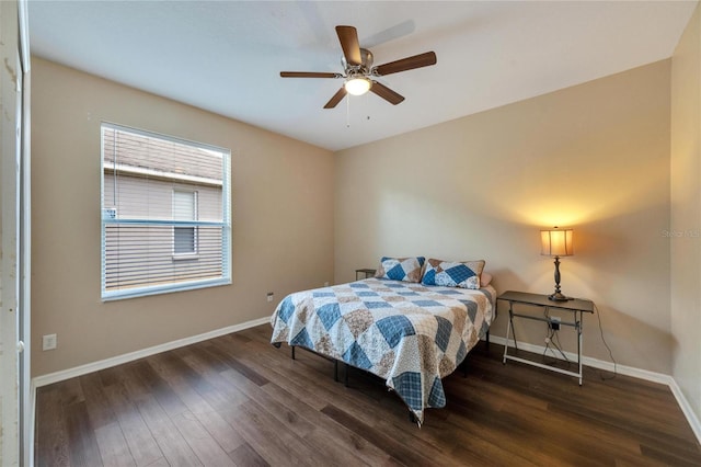 bedroom with ceiling fan and dark hardwood / wood-style floors