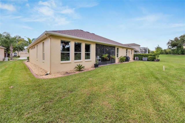 back of house with a yard