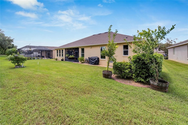 exterior space with a yard and a lanai