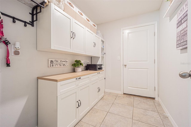 washroom featuring light tile patterned flooring