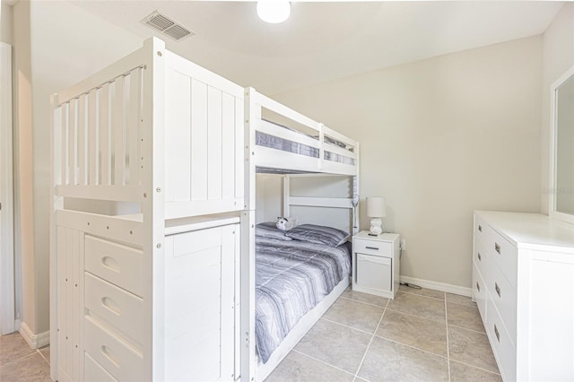 bedroom featuring light tile patterned floors