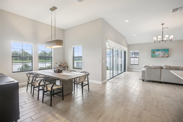dining area with light wood-style floors, recessed lighting, visible vents, and baseboards