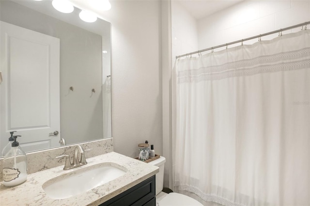 full bathroom featuring toilet and vanity