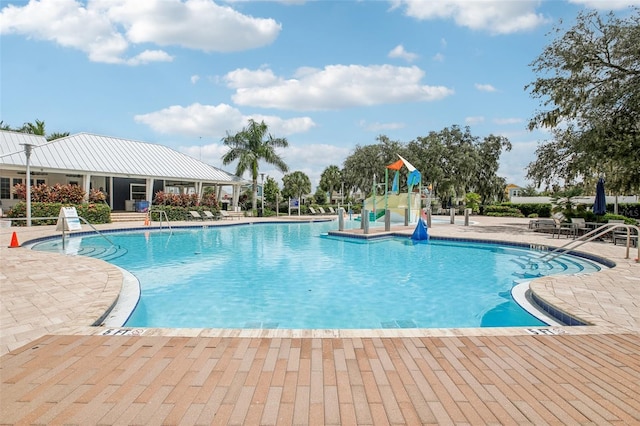 view of swimming pool featuring a patio area