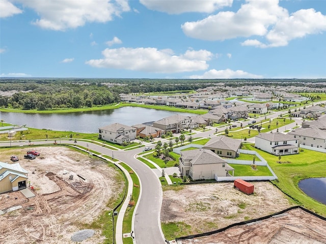 bird's eye view featuring a water view and a residential view