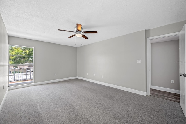 carpeted empty room featuring a textured ceiling, baseboards, and a ceiling fan