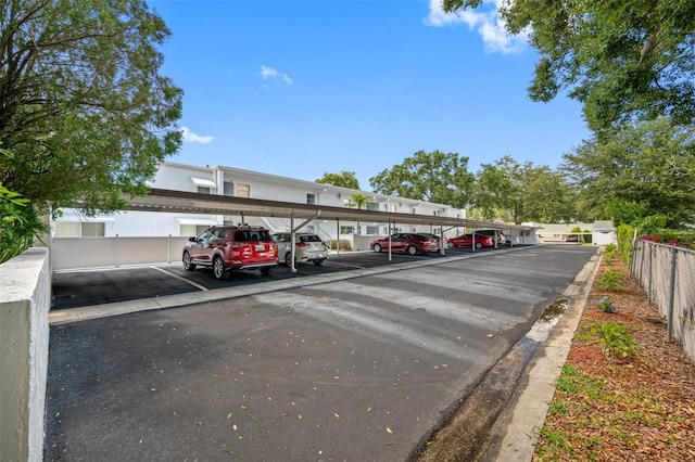 covered parking lot with fence