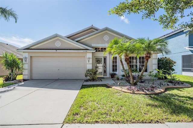 11314 Misty Isle Ln, Riverview, FL 33579 - ranch-style house with a garage, driveway, a front lawn, and stucco siding
