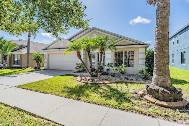 view of front of house with a front yard, concrete driveway, an attached garage, and stucco siding