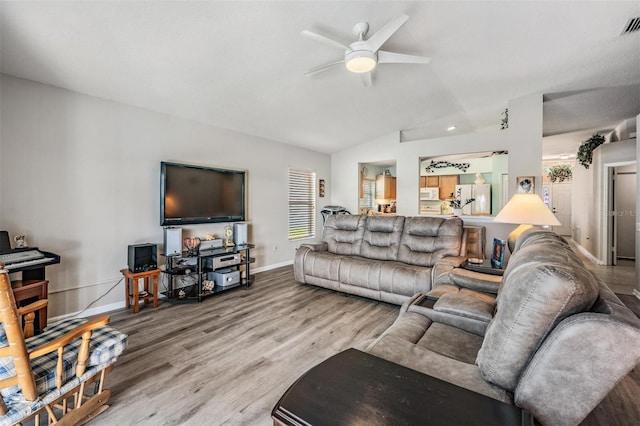 living room with ceiling fan and hardwood / wood-style flooring