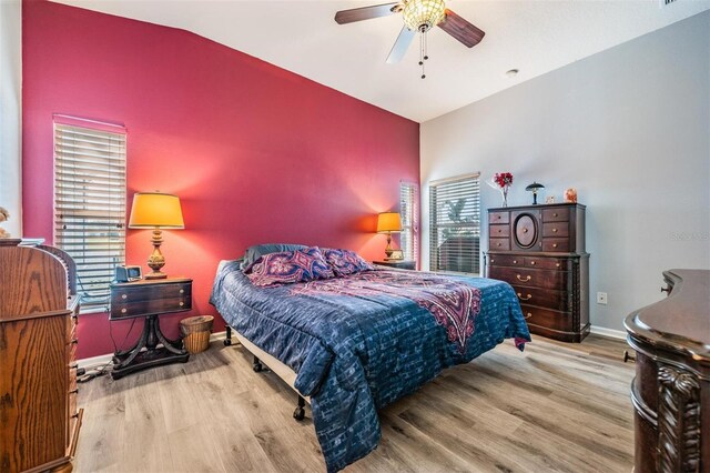 bedroom featuring vaulted ceiling, light hardwood / wood-style flooring, and ceiling fan