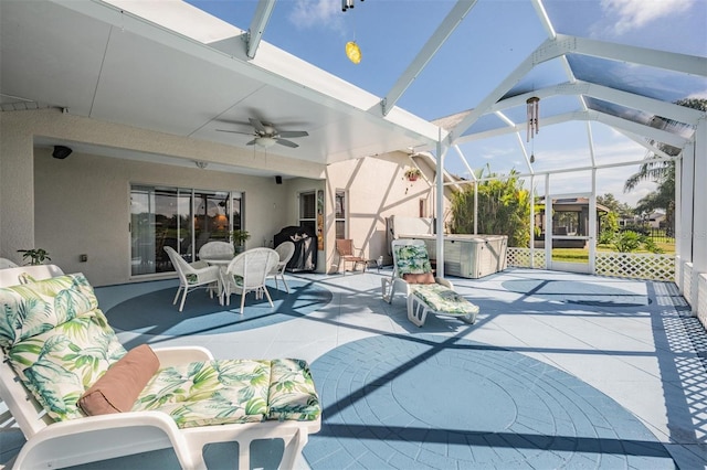 view of patio with ceiling fan and a lanai