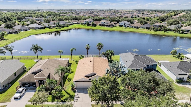 bird's eye view with a residential view and a water view