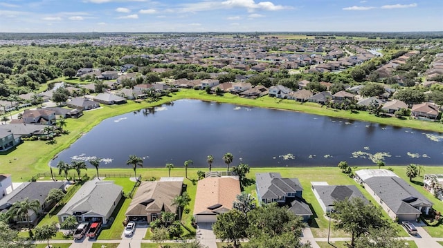 drone / aerial view featuring a residential view and a water view