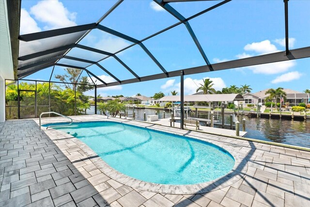 view of pool featuring a lanai, a boat dock, a water view, and a patio