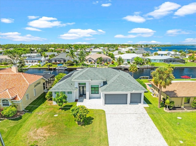 birds eye view of property with a water view