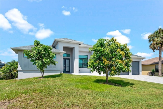 view of front facade with a front lawn and a garage