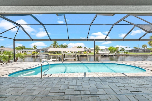 view of pool with a boat dock, a water view, glass enclosure, and a patio area