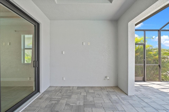 view of patio / terrace featuring a lanai